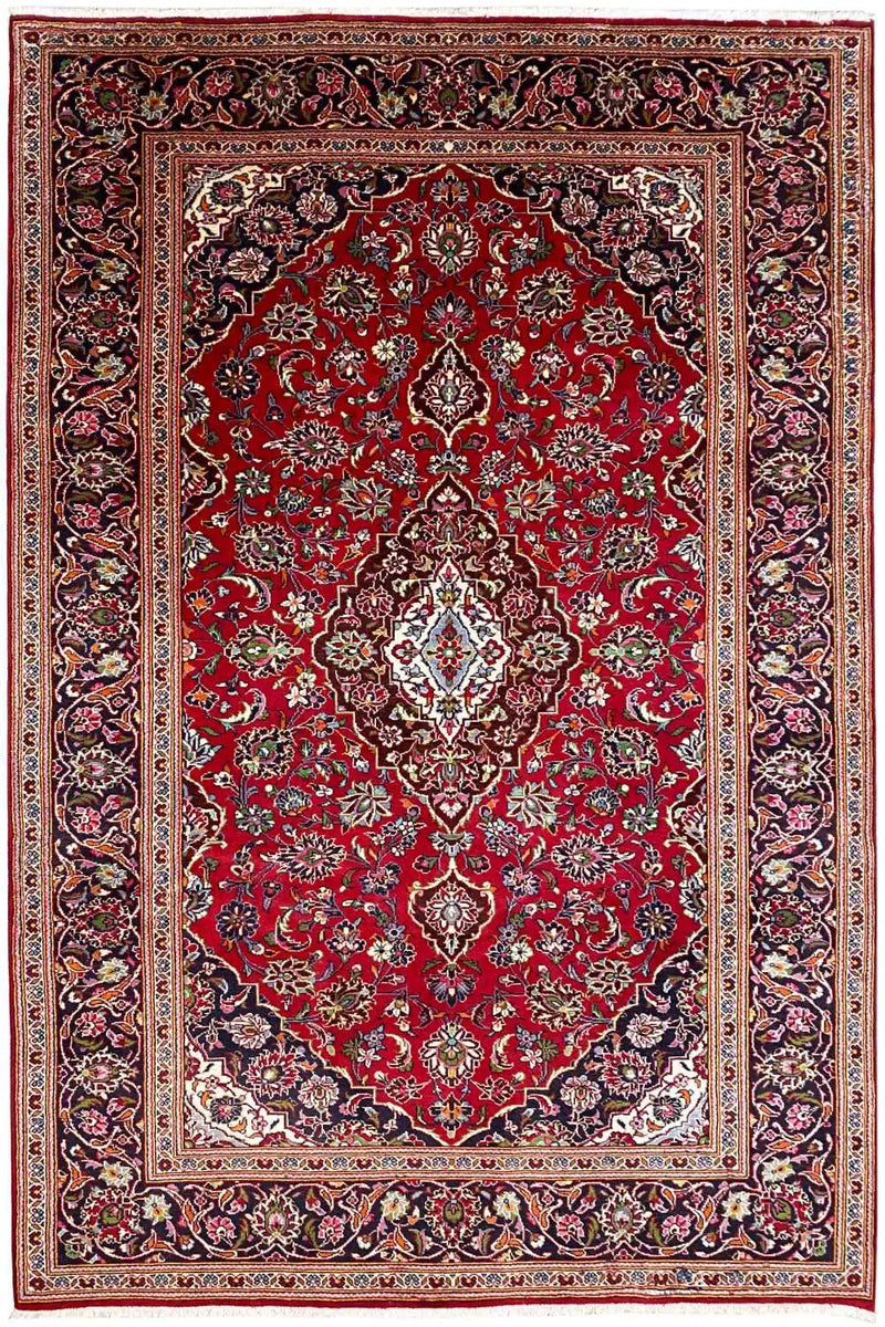 A beautiful keshan rug in Red color representing strings of flowers and a medallion. 
