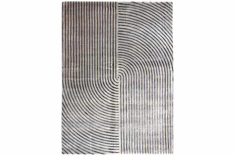 A beautiful modern designer rug with a spiral line pattern.